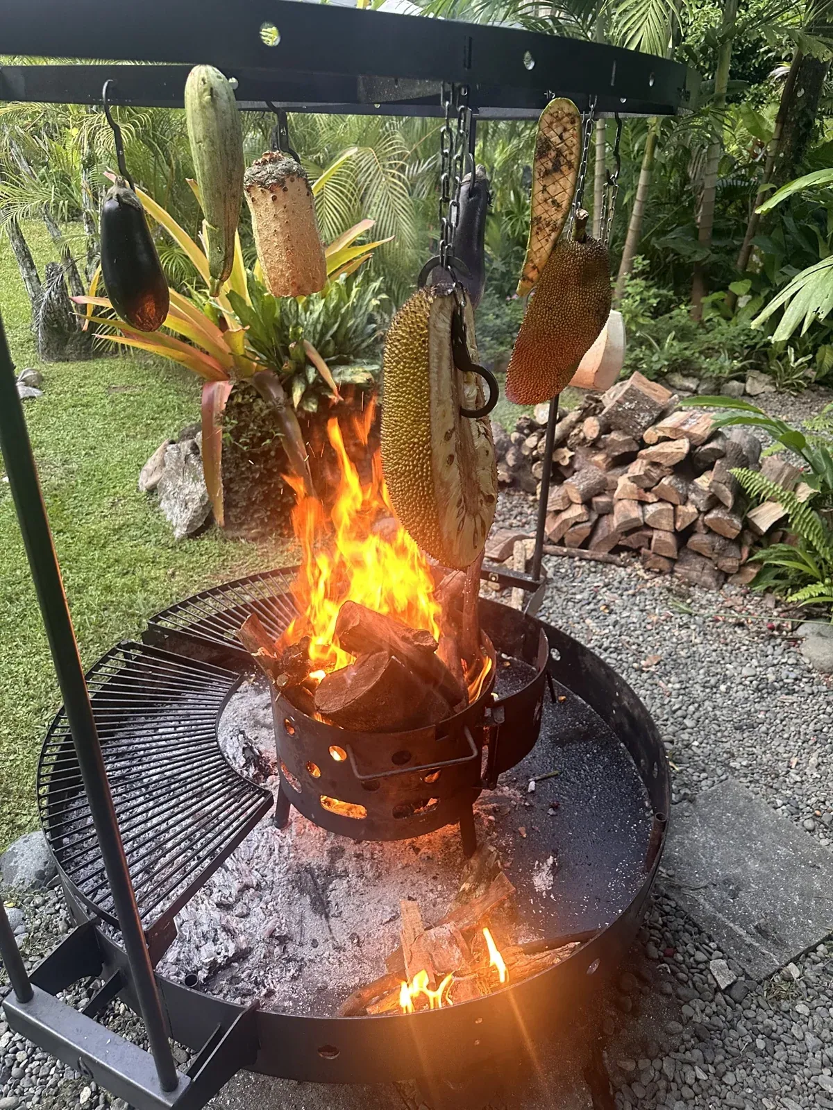Fire-cooked ingredients in a tropical garden