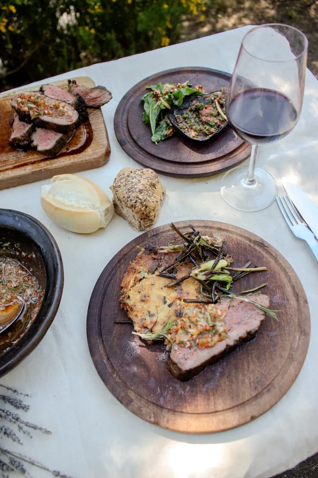 Fire-cooked dinner with bread and wine