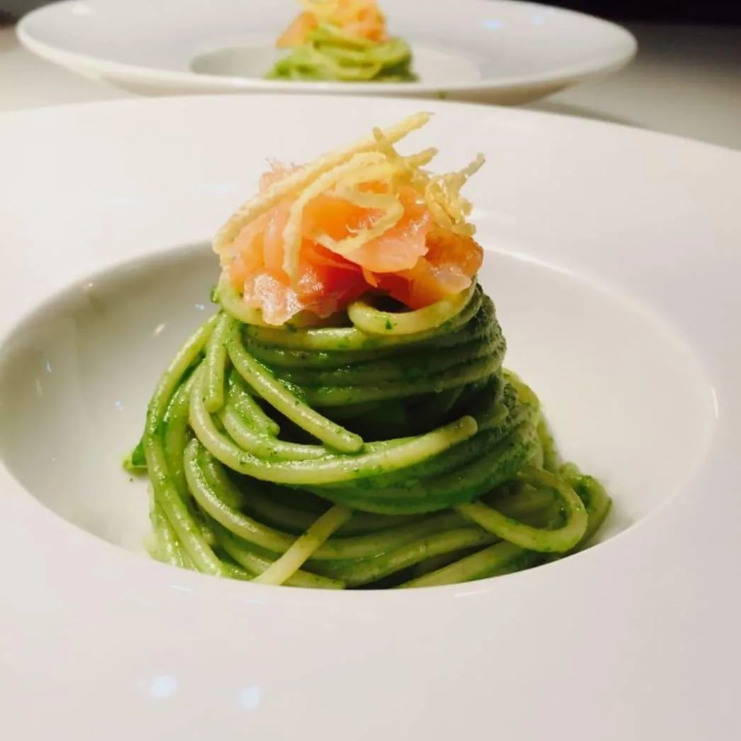 Fresh green pasta plated for a private chef dining experience